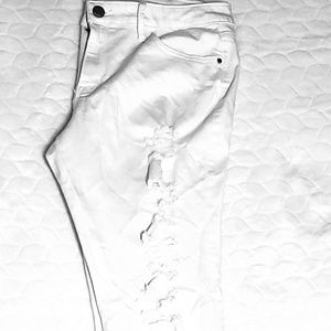 Distresses white denim jeans